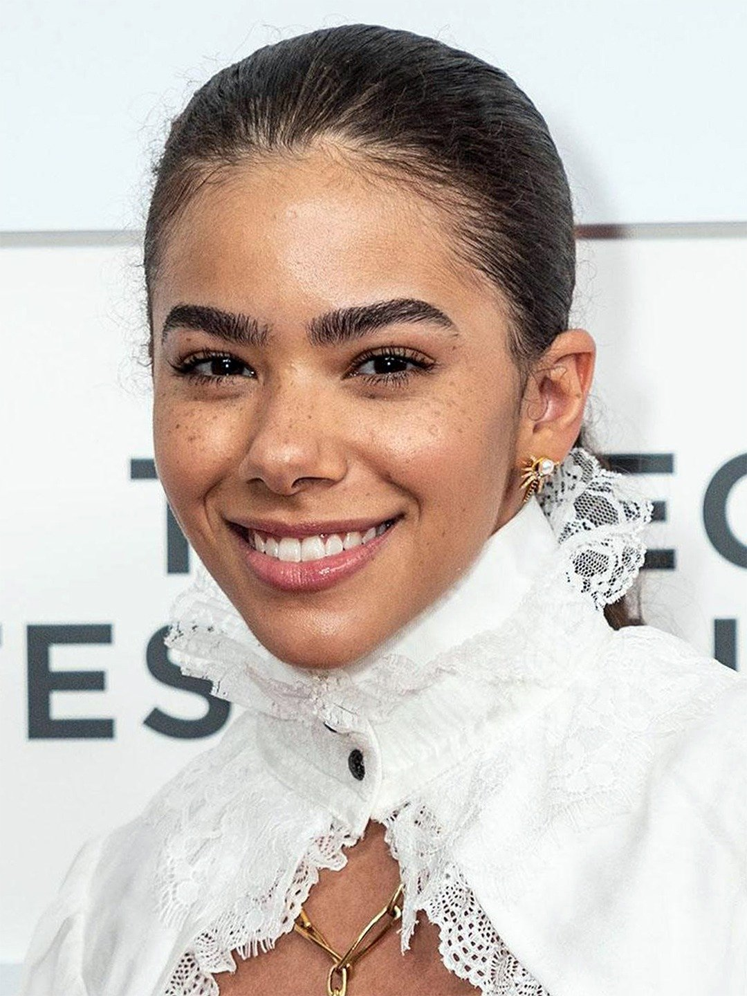 Antonia Gentry professional headshot white lace blouse warm smile
