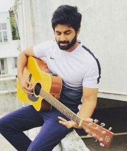 Ashwin Kumar 14 Cook with Comali Ashwin with his guitar