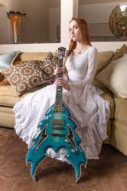 Scarlett Pomers guitar music career singer songwriter EP Insane album
